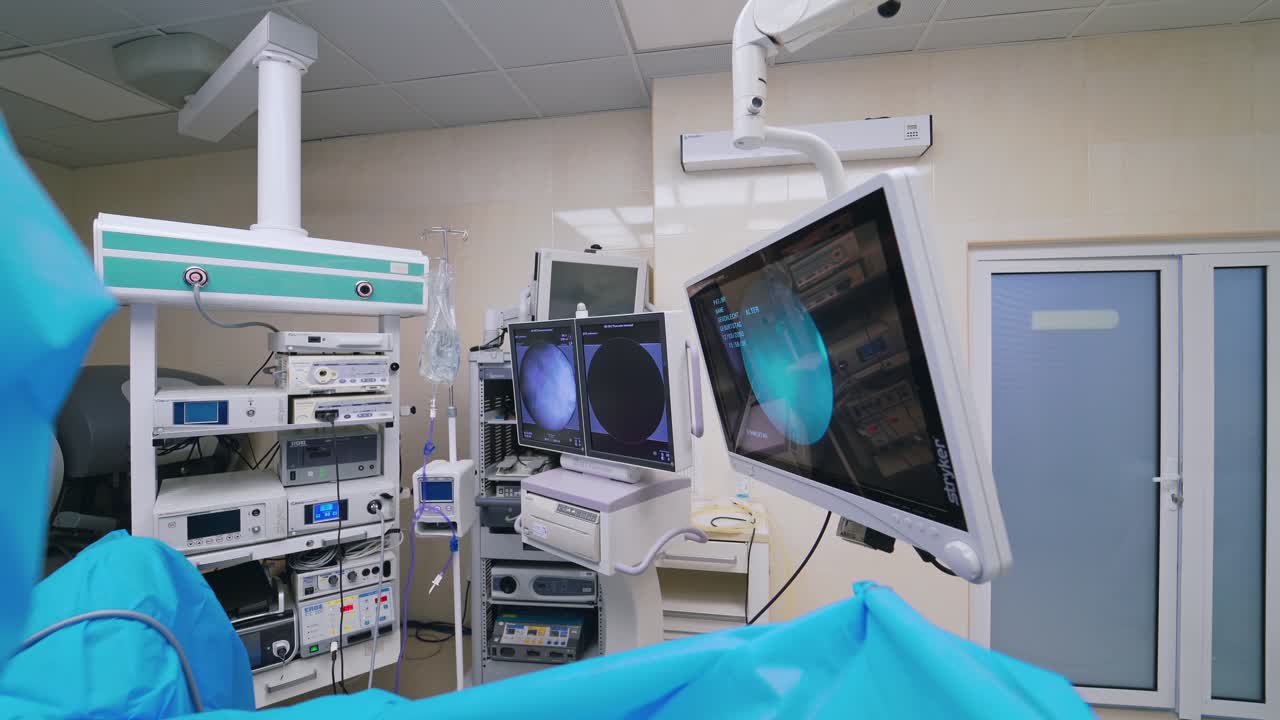 Contemporary equipment inside the operating room. Endoscopy surgery on the screen of monitor during the operation in hospital.