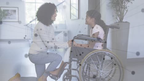 animación de la red de conexiones sobre madre y hija afroamericanas en silla de ruedas