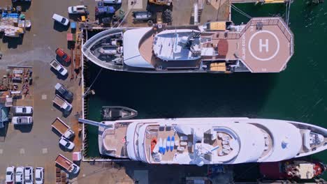 bird's eye drone view of boat with helipad docked at fremantle harbour, perth, australia