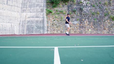 active man playing tennis