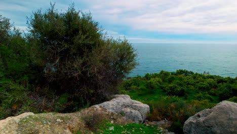 Dolley-shot-of-the-coastline-of-Nerja-on-a-cloudy-day