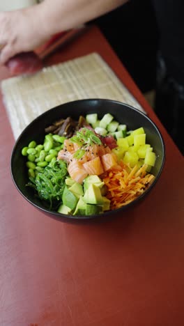 delicious poke bowl with salmon, avocado, and tuna