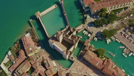 drone shot over sirmione castle, garda lake, italy