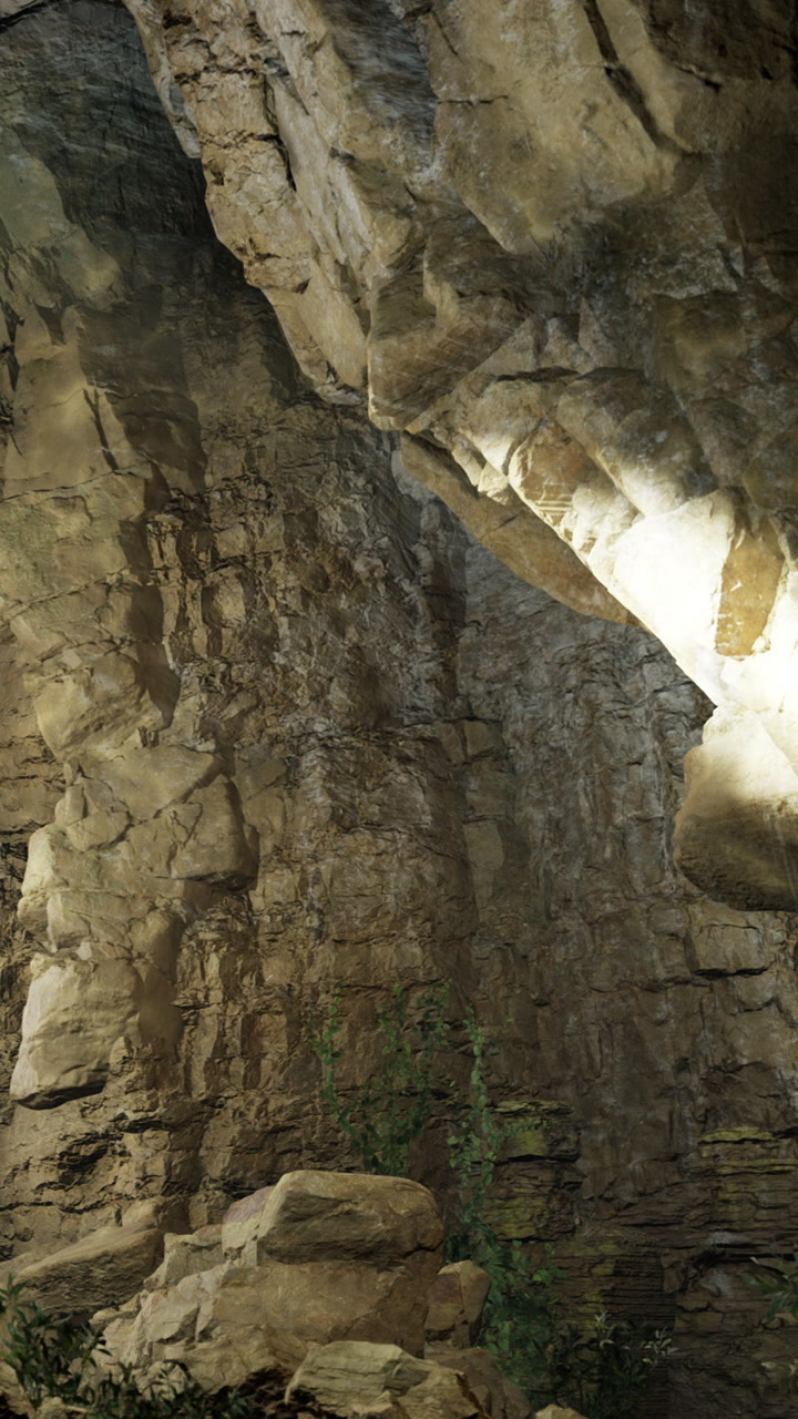 Rock formation in cave with light shining from the top during daytime