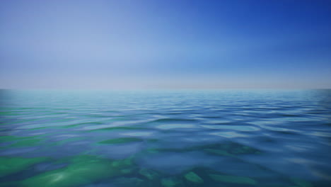 tranquil ocean scene with clear blue water and sky