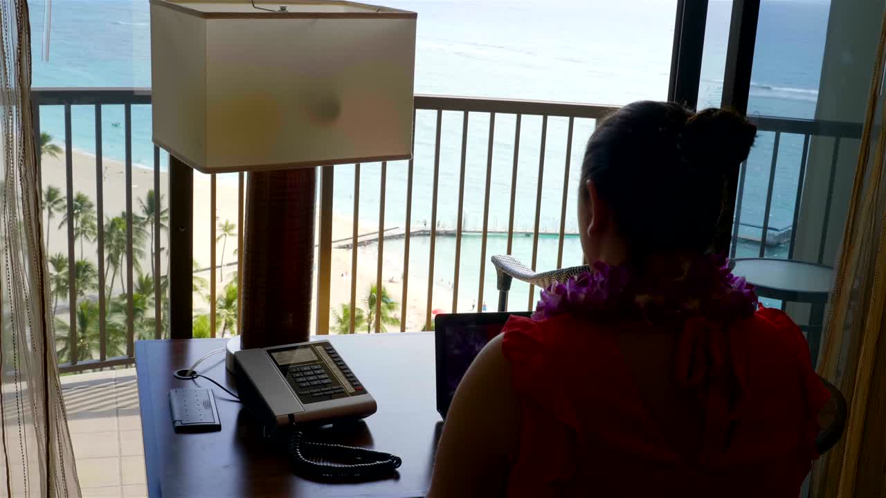 Freelancer working in paradise office in 4k slow motion