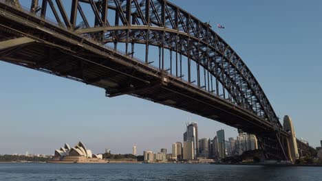 sydney opera house, harbour and downtown at sunset in australia - wide shot