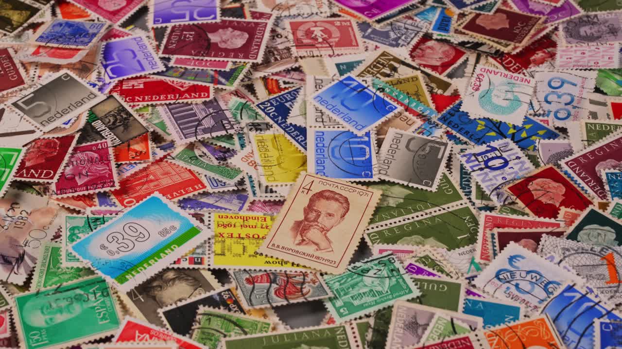 Collection of colorful postage stamps on a flat surface