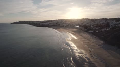 praia da luz coastline reflecting golden sunset light, algarve