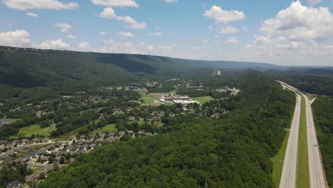 private homes district and interstate highway road, aerial drone view