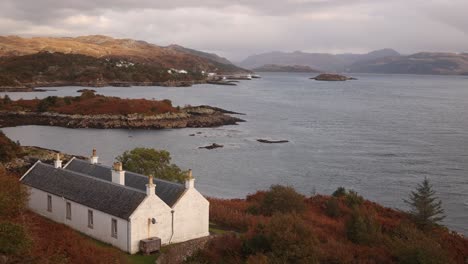 idyllic white cottage on scenic islands of isle of skye, highlands of scotland