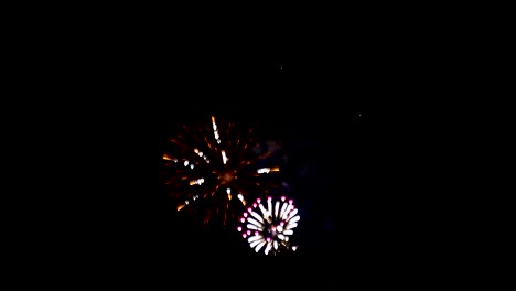 Fireworks-explode-in-a-distant-night-sky