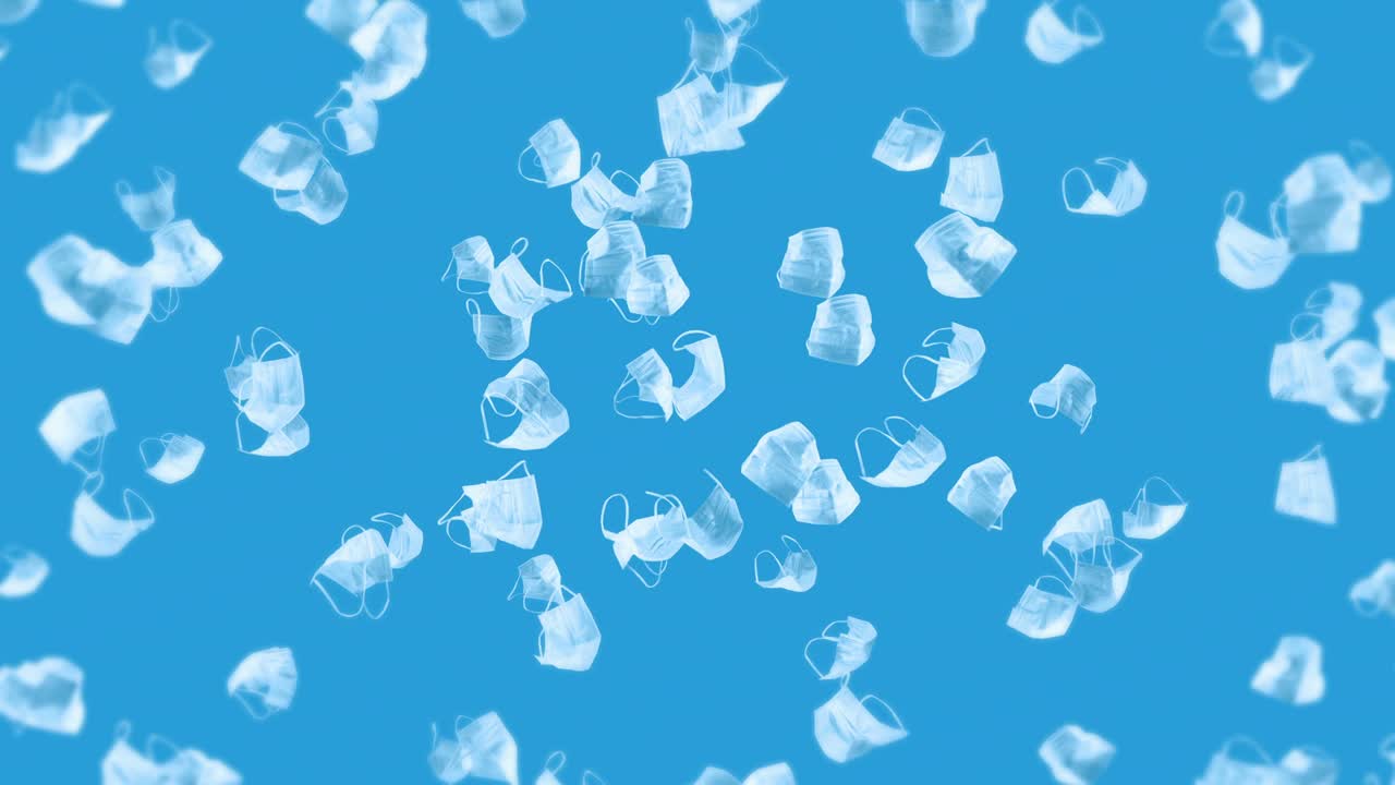 파란색 바탕에 많은 색 마스크를 날리는 의료 개념, 수술 보호 마스크, 마스크 회전의 3d 애니메이션, 루프 애니메이션.