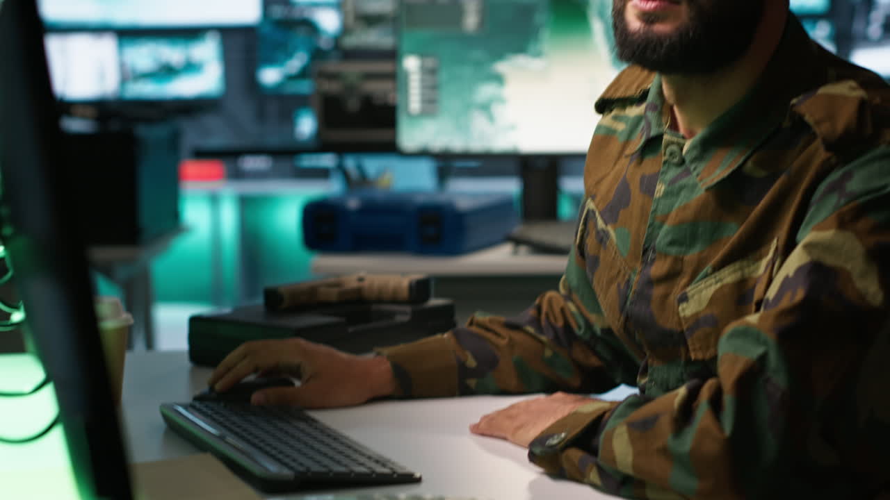 Army specialist overseeing national safety operations with devices, close up