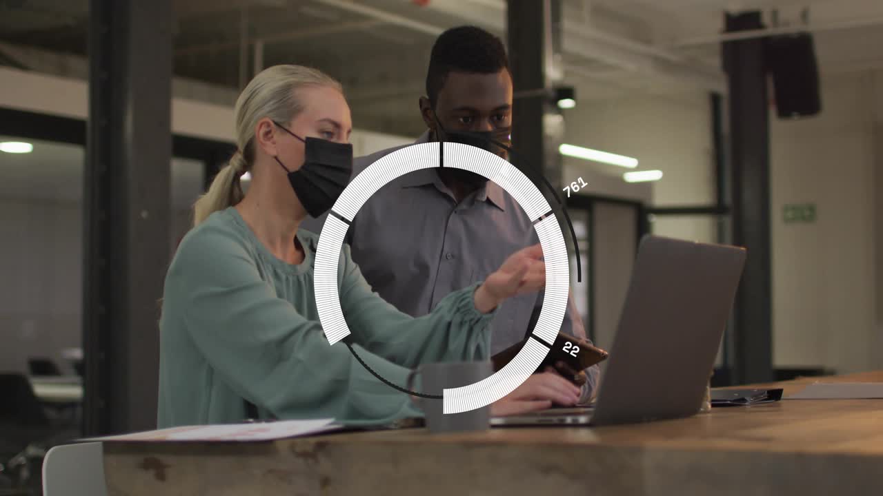 Woman tapping tablet and pointing at laptop, man typing, initiating circular overlay for business