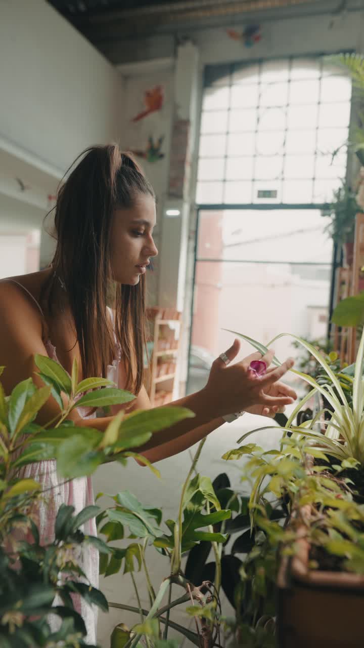 Woman caring for her houseplants