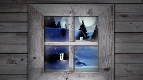 wooden window frame against snowflakes falling over multiple houses and trees on winter landscape