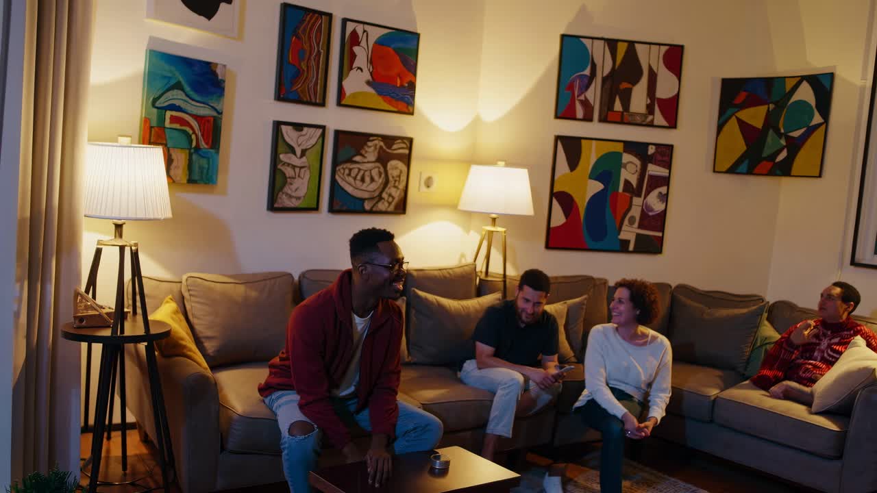 Cozy living room video scene with friends on a sofa, surrounded by abstract art