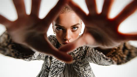 fashion model reaching towards camera in slow motion montage