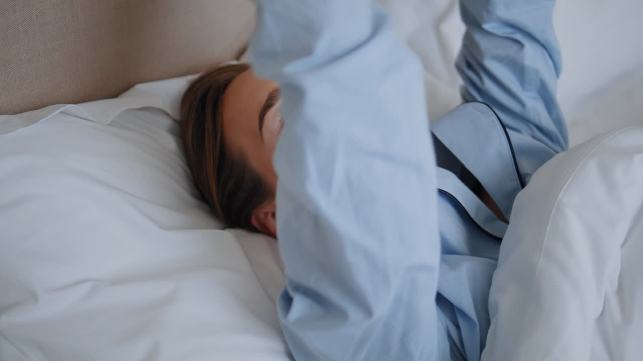 Portrait smiling model lying bed at home closeup. Happy woman looking camera