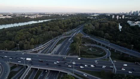 aerial view of a complex highway interchange and cityscape