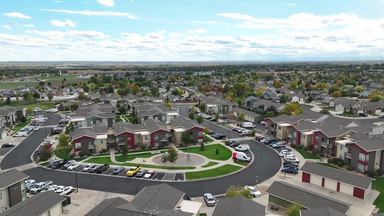 Greeley Colorado neighborhood with condominiums, aerial establishing shot fall 2025