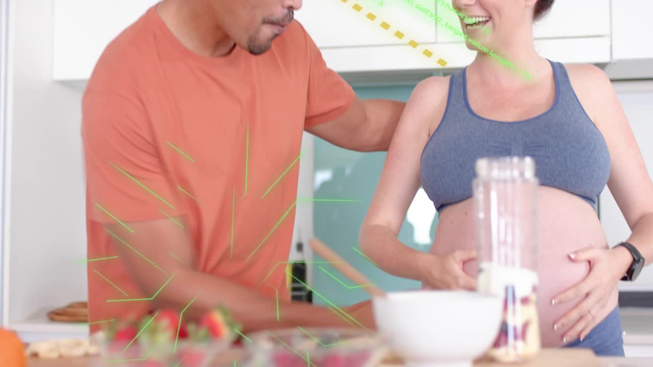 Pregnant woman scooping yogurt into mixer sweeping green overlay, partner hands on belly for health