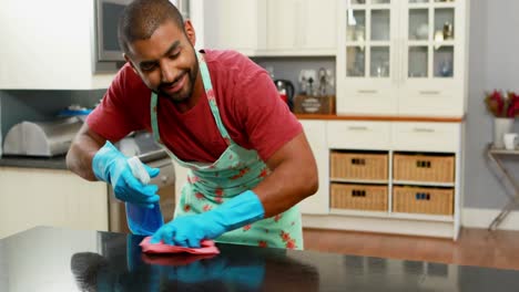 man cleaning the kitchen worktop 4k