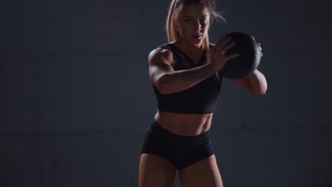 woman exercising with medicine ball