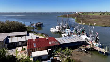 aerial slow push over shrimp trawlers along shem creek near charleston sc, south carolina