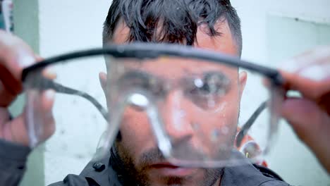 Man-is-wearing-transparent-work-glasses-during-his-work-as-a-firefighter