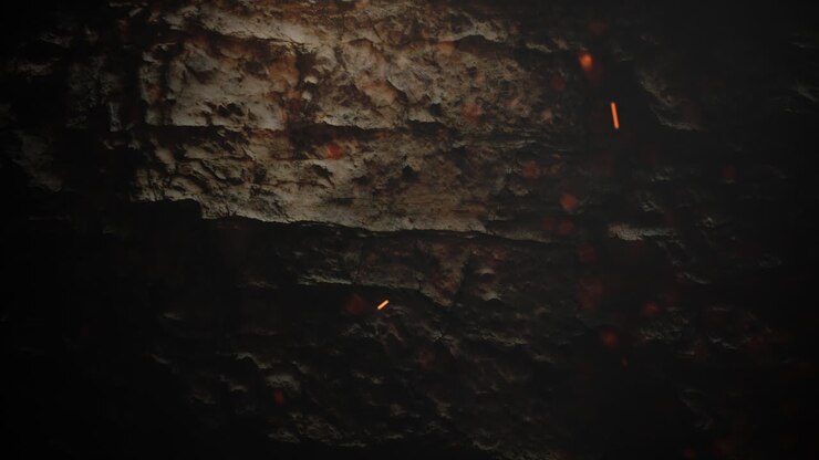 fliegengold glitzert auf dunkler grunge-textur aus stein