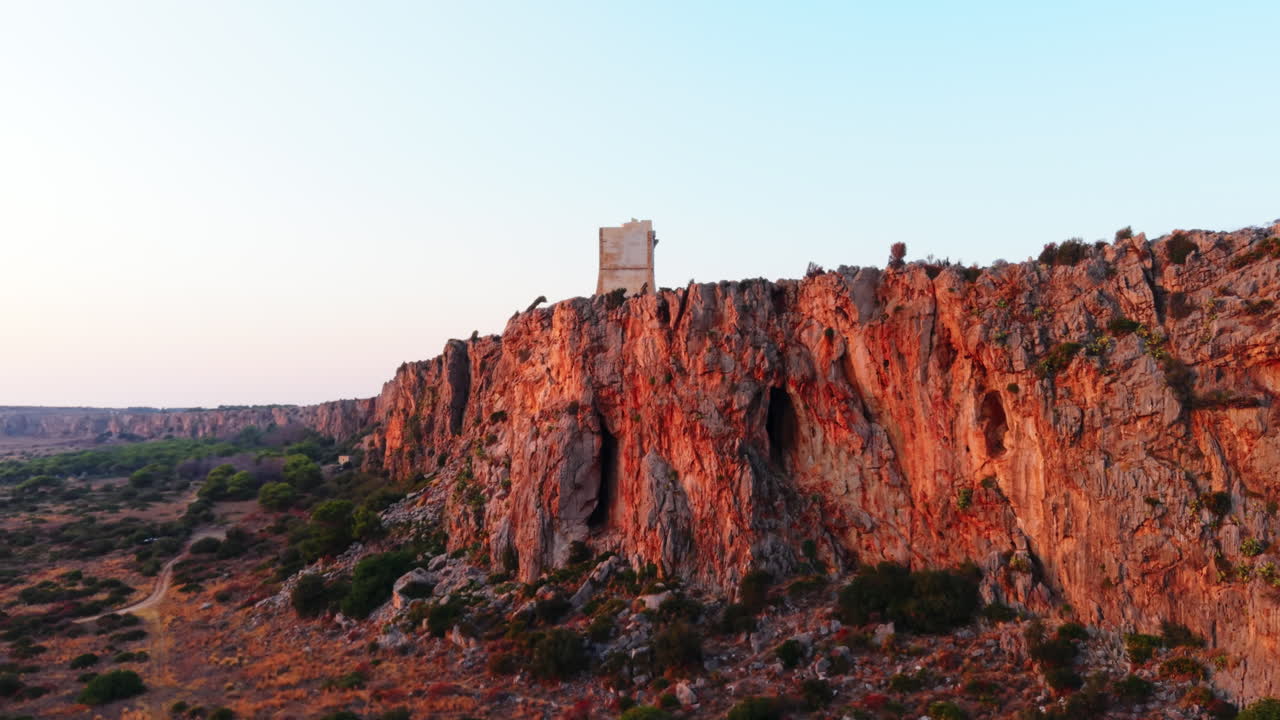 Sunset cliffs in Sicily create a stunning, serene backdrop for reflection