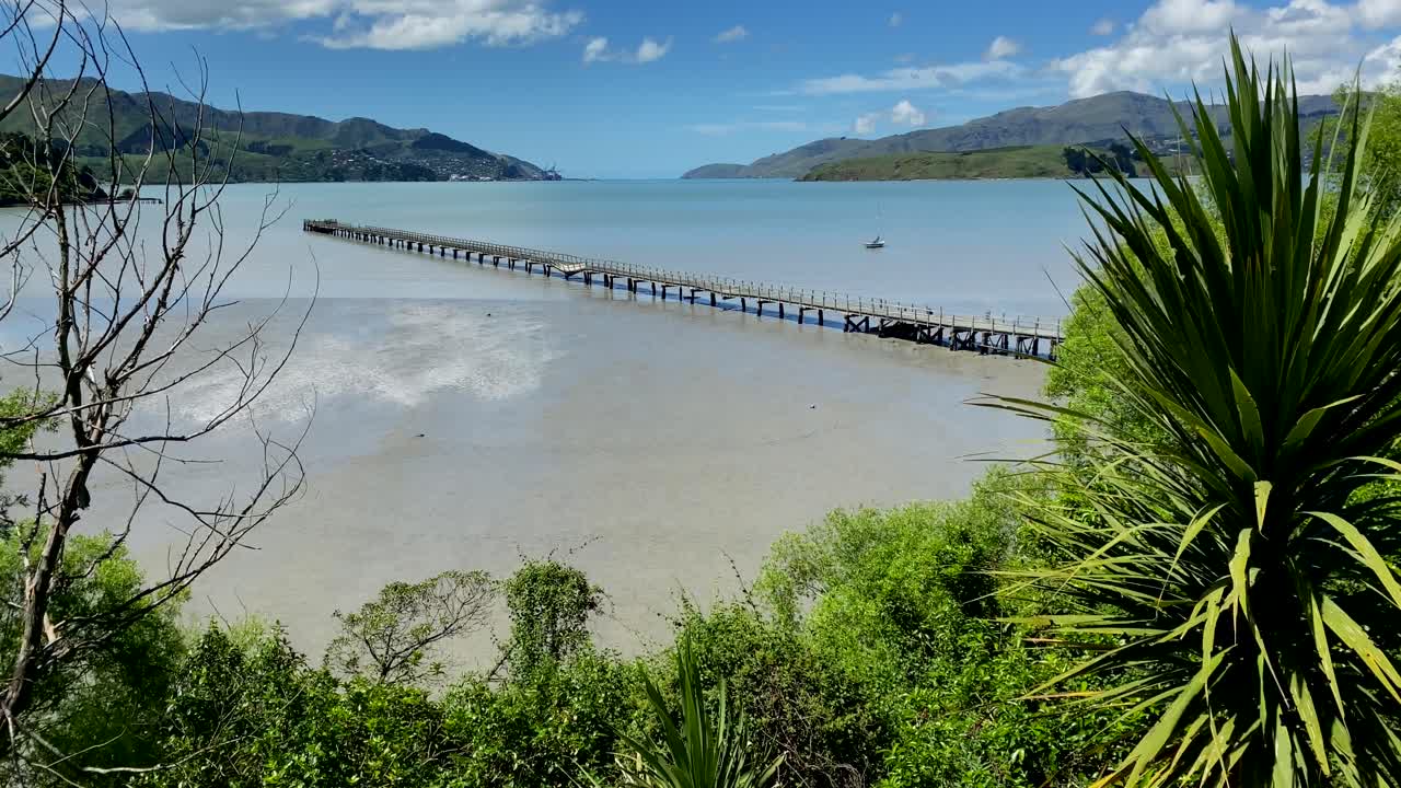 Sunny day at Governors Bay Jetty and Lyttelton harbour in the background