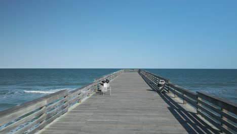 beautiful symmetrical tracking shot of crystal pier, wrightsville beach north carolina