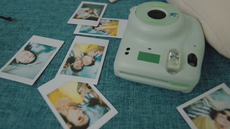 instant photos of friends on a sofa