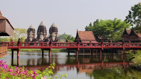 serene temple complex with bridge and reflection