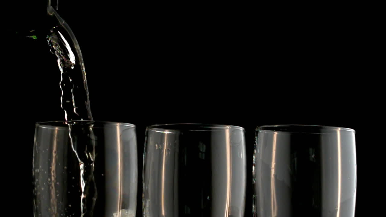 Animation of burning layer over glasses of champagne