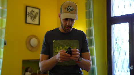 vlogger with cap setting new dji osmo pocket 3 stabilized 3-axis mobile gimbal camera in indoorhouse room