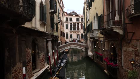 picturesque venice canal river with gondola boats in italy, static