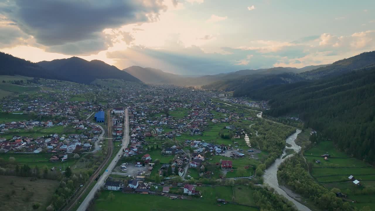 Drone video of Campulung city at sunset with surrounding nature