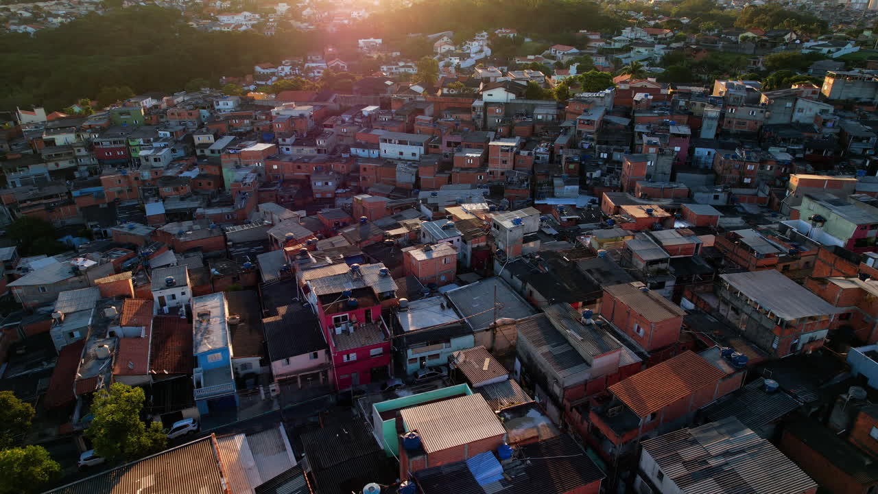 Aerial view over slum houses in the Nova Jaguare favela sunset in Sao Paulo, Brazil