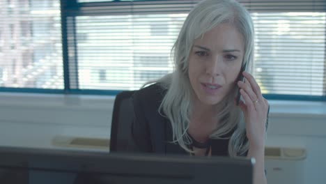 happy businesswoman using computer