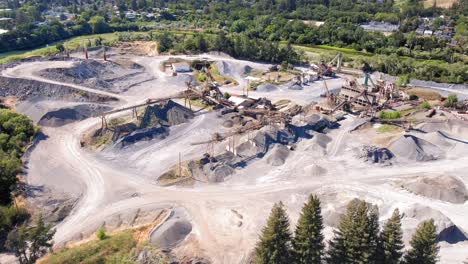 Massive-concrete-yard-and-quarry-near-San-Francisco,-California---aerial-parallax-view