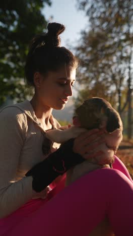 woman with puppy in park