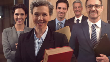 smiling lawyers holding documents