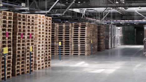 warehouse with stacked wooden pallets