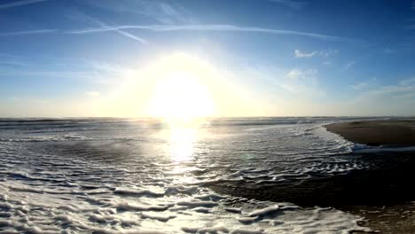 algae foam in storm on the beach, sandy beach with waves, north sea, jütland, sondervig, denmark, 4k