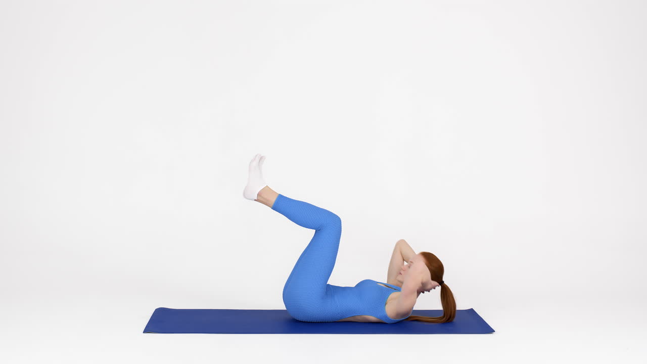 Woman doing crunches on a mat