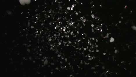 falling shiny hearts at night. slow motion